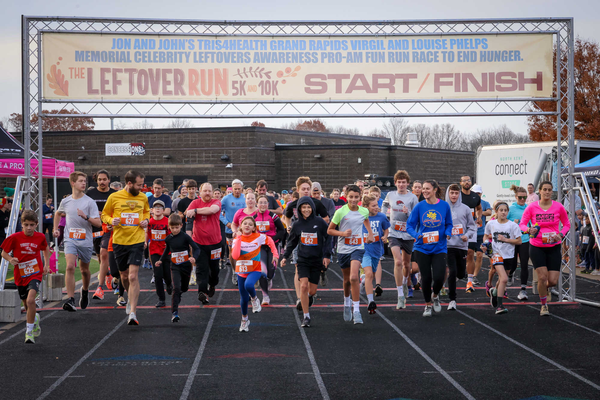 Runners setting off beneath the Leftover Run start banner